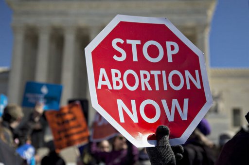 An anti-abortion demonstrator outside the U.S. Supreme Court in Washington, D.C., in March. Last month the high court struck down a Texas law that imposed tight regulations on abortion providers.